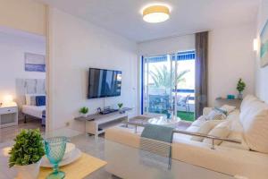 Televízia a/alebo spoločenská miestnosť v ubytovaní Apartamento Pink Calm
