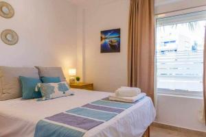 Posteľ alebo postele v izbe v ubytovaní Apartamento Pink Calm