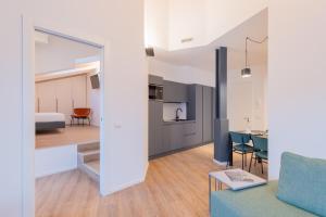 a view of a living room and kitchen from the living room at Minerva Guesthouse in Trento