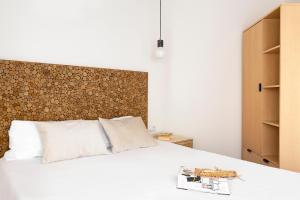 Posteľ alebo postele v izbe v ubytovaní WOW Apartments by Olala Homes