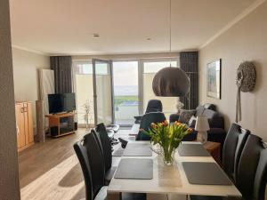TV a/nebo společenská místnost v ubytování Haus Seewärts Wohnen Apartment 3 1
