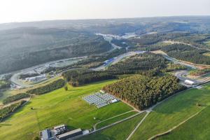an aerial view of a field with solar panels at GPtents in SPA in Spa
