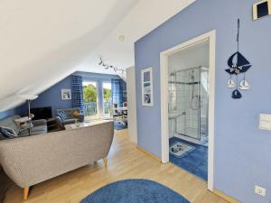 a living room with a couch and a shower at _STR132b_ Haus Maren am Meer in Niendorf +13 photos