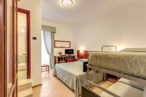 TV a/nebo společenská místnost v ubytování Hotel Flavio + 16 fotografií