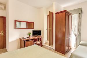 TV a/nebo společenská místnost v ubytování Hotel Flavio