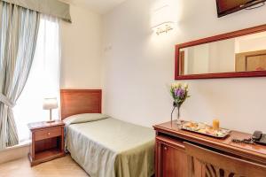 Postel nebo postele na pokoji v ubytování Hotel Flavio