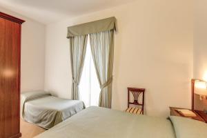 Postel nebo postele na pokoji v ubytování Hotel Flavio
