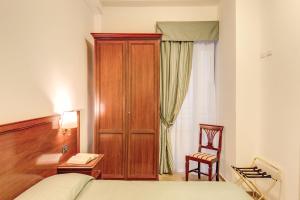Postel nebo postele na pokoji v ubytování Hotel Flavio