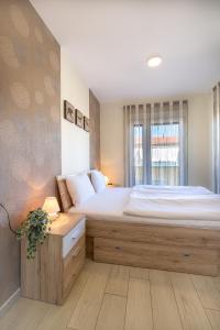 Posteľ alebo postele v izbe v ubytovaní Casa Luxury Wellness Apartman By BLTN