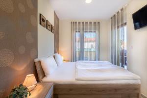 Posteľ alebo postele v izbe v ubytovaní Casa Luxury Wellness Apartman By BLTN