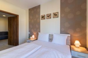 Posteľ alebo postele v izbe v ubytovaní Casa Luxury Wellness Apartman By BLTN