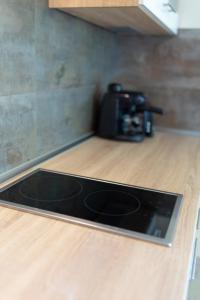 Kuchyňa alebo kuchynka v ubytovaní Casa Luxury Wellness Apartman By BLTN
