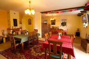 a kitchen and dining room with a table and chairs at Ubytování Edita in Boží Dar