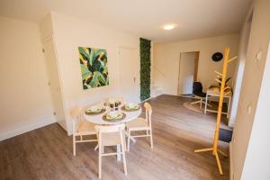 a dining room with a table and chairs in a room at Lovely 3 Bedroom Apartment in Eindhoven 65m2 - SD23N in Eindhoven
