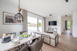 Televisyen dan/atau pusat hiburan di Villa "Zweite Heimat - Exklusive Penthouse No 3