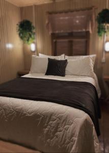 Cama o camas de una habitación en Rústico Chalé