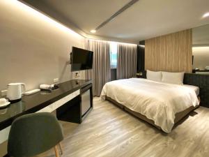 Postel nebo postele na pokoji v ubytování Hub Hotel Ximen Inn