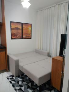 A bed or beds in a room at Apartamento próximo ao Farol da Barra