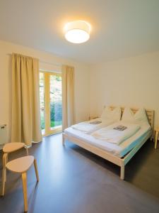 Postel nebo postele na pokoji v ubytování Hostel Zahrada Mikulov
