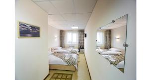 Llit o llits en una habitació de Hotel Irkut