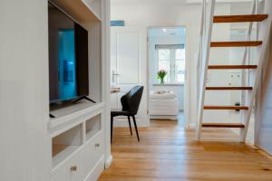 TV a/nebo společenská místnost v ubytování Ferienwohnung Käthe