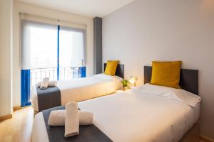 Postel nebo postele na pokoji v ubytování Lucas House Apartments by Sitges Group