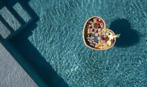 an overhead view of a basket of food in the water at Absolute Paradise Santorini in Akrotiri