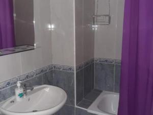 a bathroom with a sink and a tub and a shower at Apartamento Zig Zag in Murcia