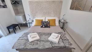 Postel nebo postele na pokoji v ubytování Casa Storica Piazza 5 Giornate