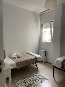 A bed or beds in a room at VTZ El Balcón de Rey Alfonso V