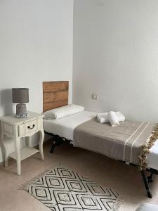 A bed or beds in a room at VTZ El Balcón de Rey Alfonso V