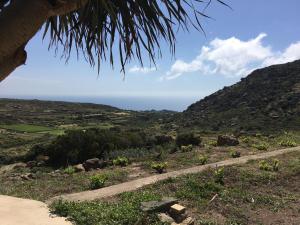 a view of the ocean from a mountain at Dammusi IL SERRALH -Pantelleria- in Pantelleria
