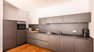 Η κουζίνα ή μικρή κουζίνα στο Chalet am Breitenberg Appartement CB 11 +14 φωτογραφίες
