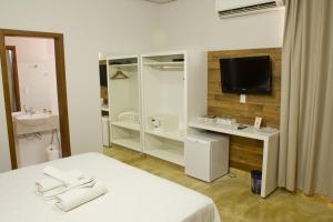 Et tv og/eller underholdning på Pousada Parador da Figueira