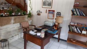 an office with a desk with a printer on it at Le Clos du Merry in Joux-la-Ville