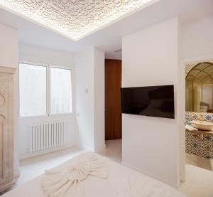 Telewizja i/lub zestaw kina domowego w obiekcie Plaza España V calle San Bernardino 6BR 6BH
