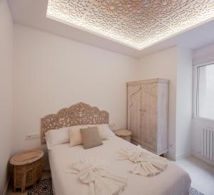 Łóżko lub łóżka w pokoju w obiekcie Plaza España V calle San Bernardino 6BR 6BH