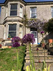 a house with purple flowers in front of it at Southernhay in Beer