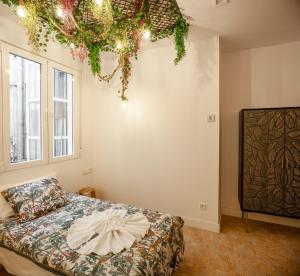 Łóżko lub łóżka w pokoju w obiekcie Plaza España V calle San Bernardino 6BR 6BH