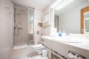a bathroom with a sink and a shower and a toilet at Inselresidenz Strandburg - Studio 110 (Ref: 50961) in Juist