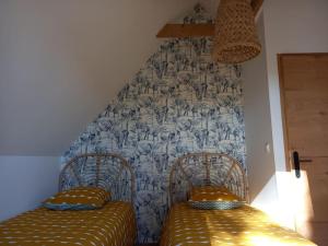 Postel nebo postele na pokoji v ubytování Gîte Versant Ouest, 700 m des plages. + 3 fotografie