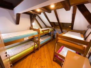 a room with bunk beds in a attic at Hostel Vagabond in Sarajevo