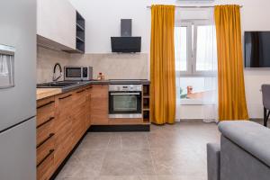 Kuchyň nebo kuchyňský kout v ubytování Vale Mare Apartment