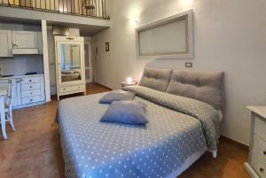 A bed or beds in a room at Bio Agriturismo Valle dei Calanchi