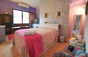 A bed or beds in a room at Bio Agriturismo Valle dei Calanchi