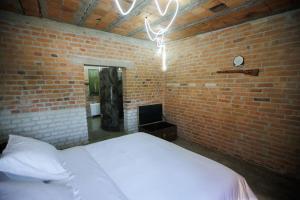 Postel nebo postele na pokoji v ubytování Kazerma e Cerenit