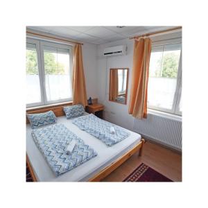 Letto o letti in una camera di Balaton Vendégház Fonyód