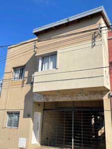 a building with a large garage at Pueblo Nuevo in Junín +6 photos
