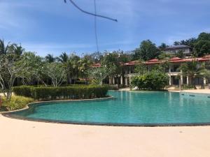a swimming pool in front of a resort at Pool Villa Phuket 2 bedroom in Layan Beach