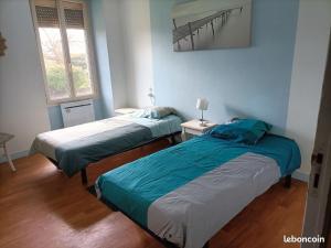 Ένα ή περισσότερα κρεβάτια σε δωμάτιο στο Gite du Mottay